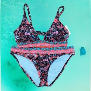 New bikini. Back strap has two size slots and the straps are adjustable.